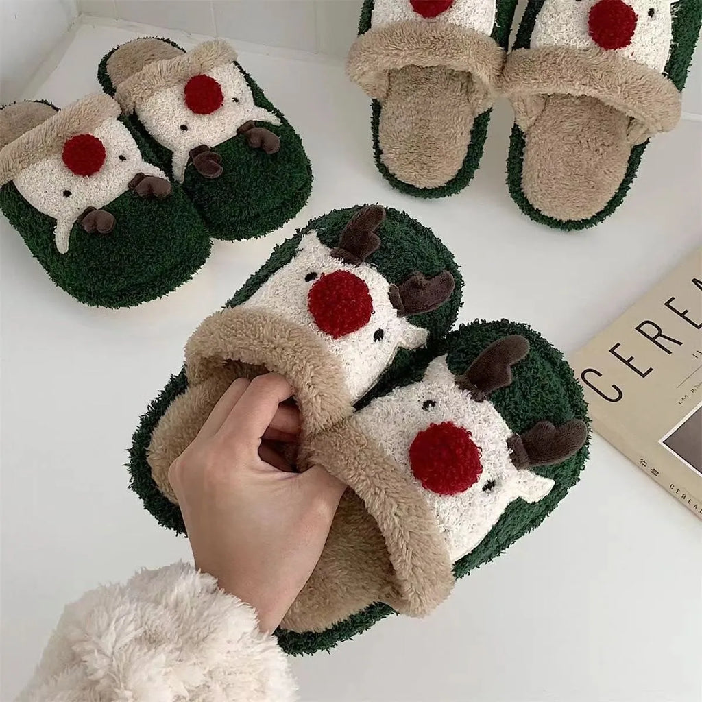 Women's green plush Christmas slippers with an elk design and a non-slip PVC sole.