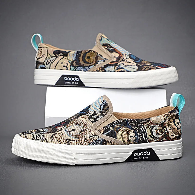 A pair of khaki-coloured canvas slip-on sneakers with a low-top profile, round toe, and vulcanised rubber sole on a plain background.