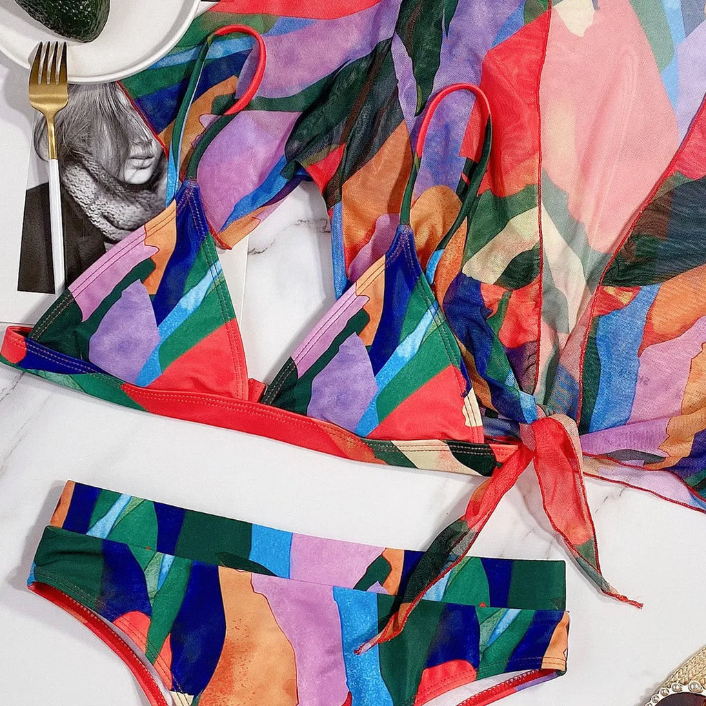 Red women's printed split swimsuit with surf styling and nylon fabric
