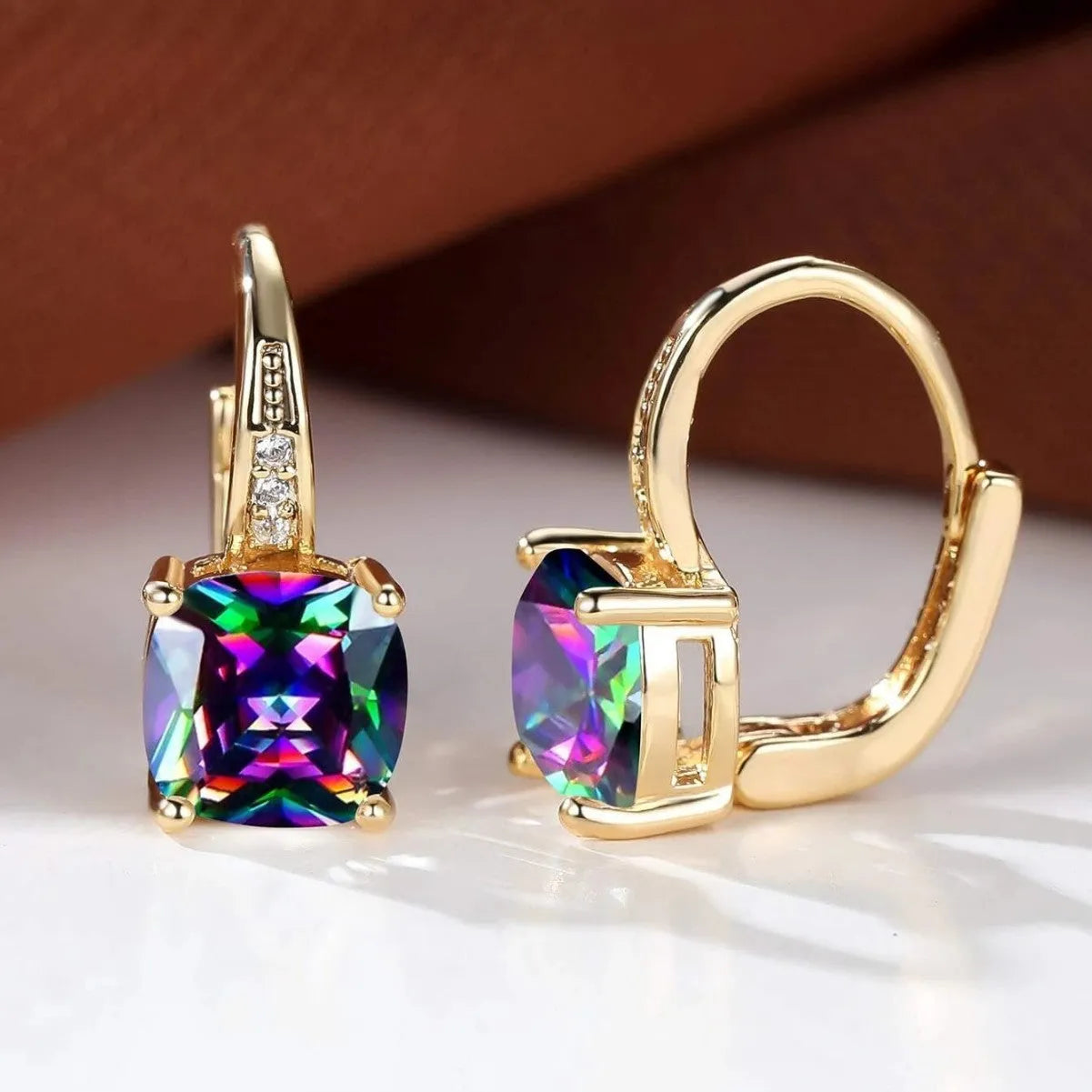 Geometric quadrilateral ear clips with moissanite inlays and electroplated copper construction in gold finish