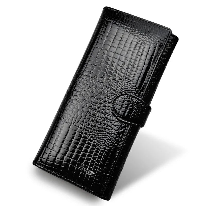 Women's leather purse with crocodile pattern design in wine red colour showing interior pigskin lining