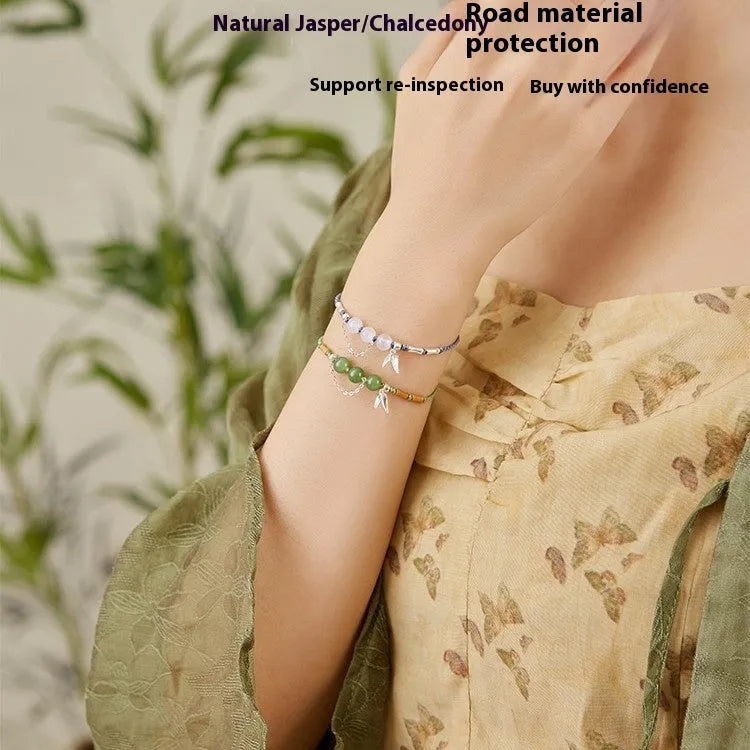 Women's Hetian jade bracelet with woven strap, diamond beads, and lotus seedpod charm in light green or haze blue