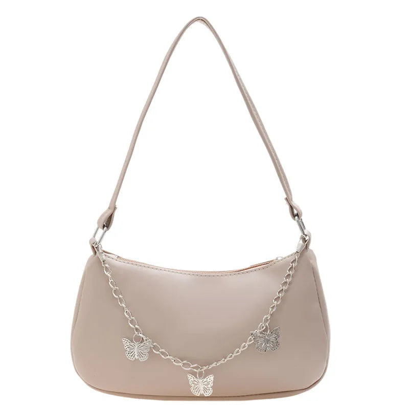 Black butterfly chain underarm bag showing three-dimensional pocket and adjustable metal chain strap