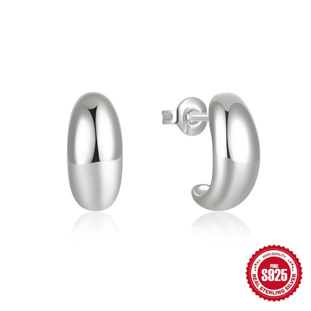 C-shaped sterling silver stud earring with glossy electroplated finish in gold or white gold colour