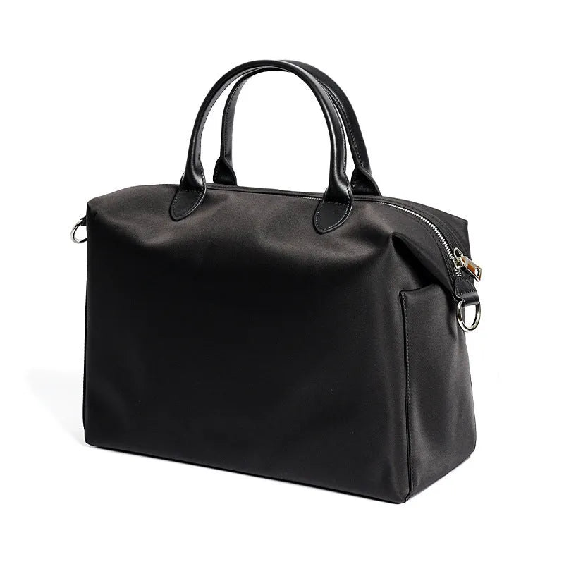 Nylon waterproof shoulder bag with leather handles in black or light khaki colour
