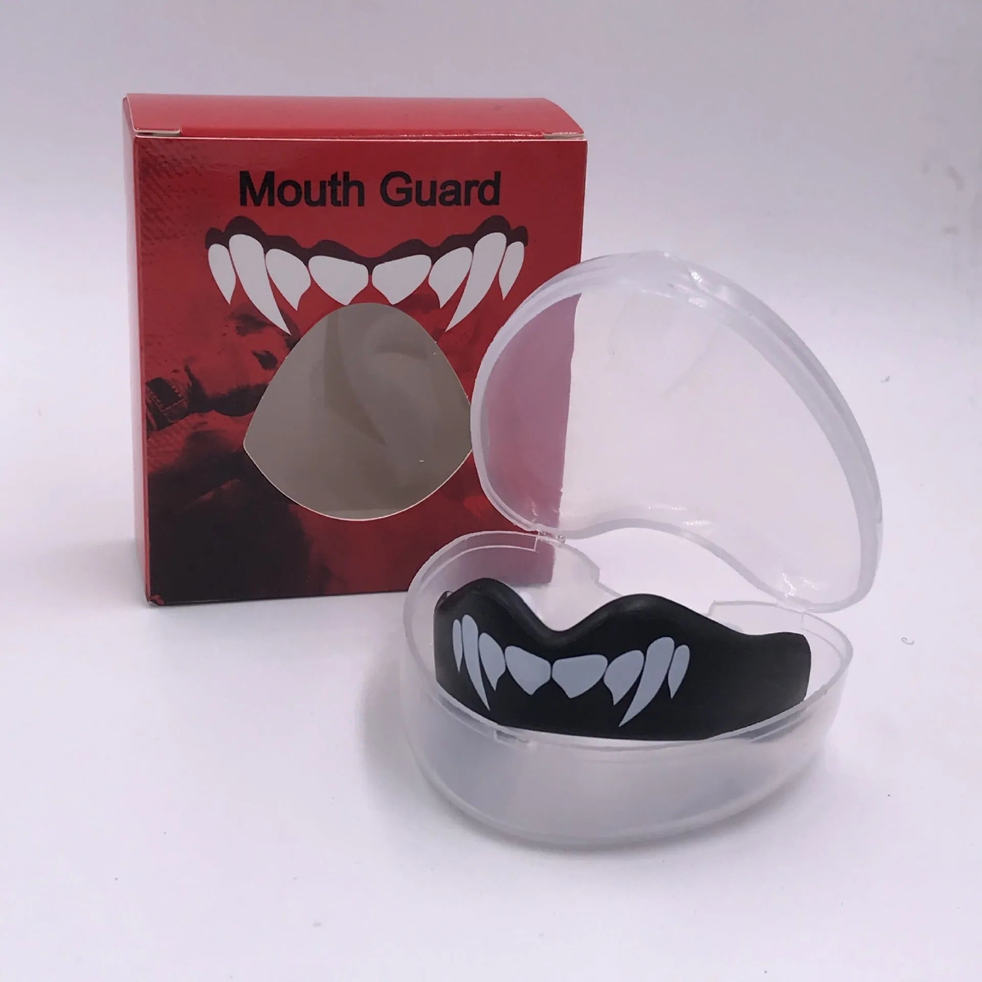 Adult boxing mouthguard with tooth socket design in black/white colour variant showing printed teeth pattern