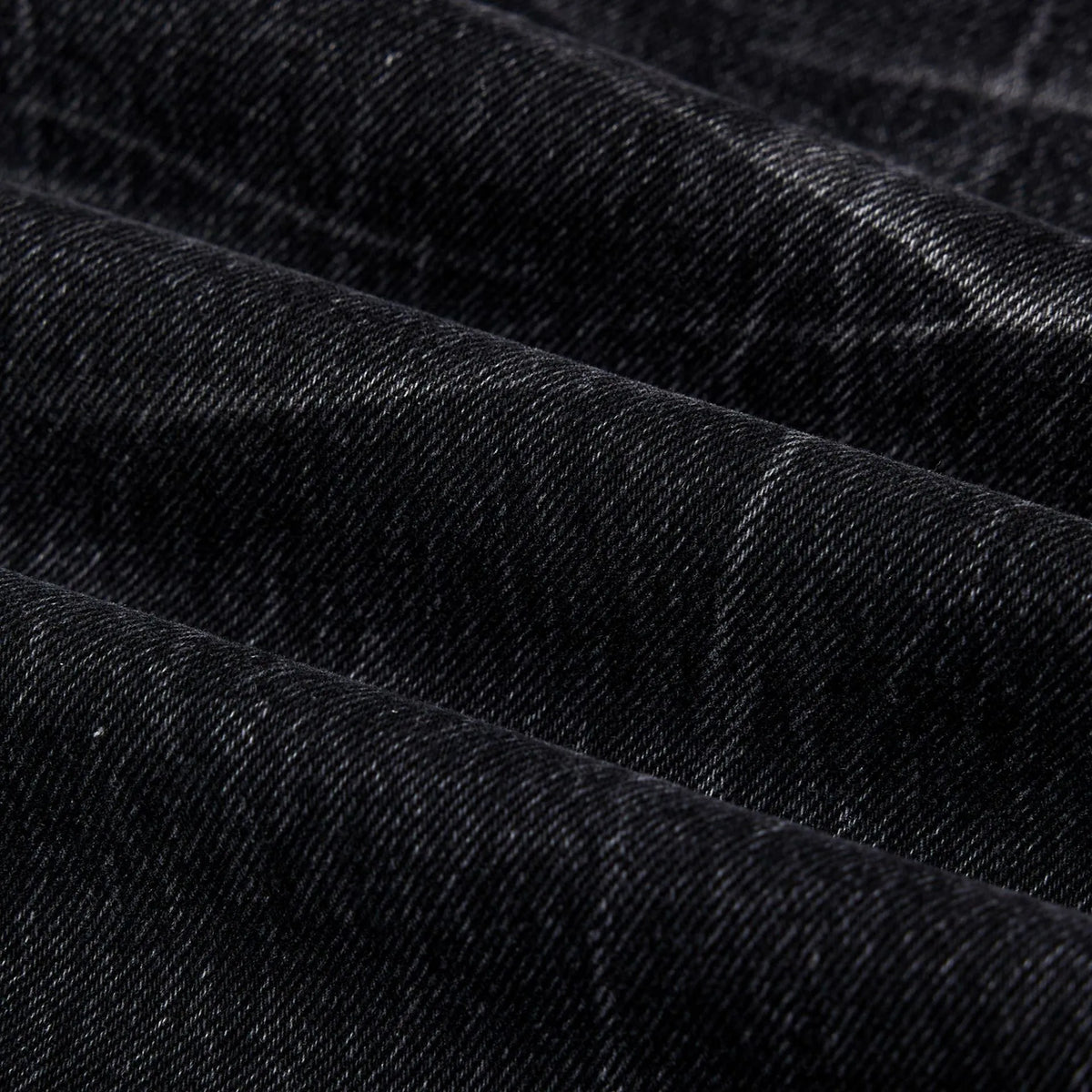 Men's black straight-leg jeans with faded lightning crack pattern on cotton denim