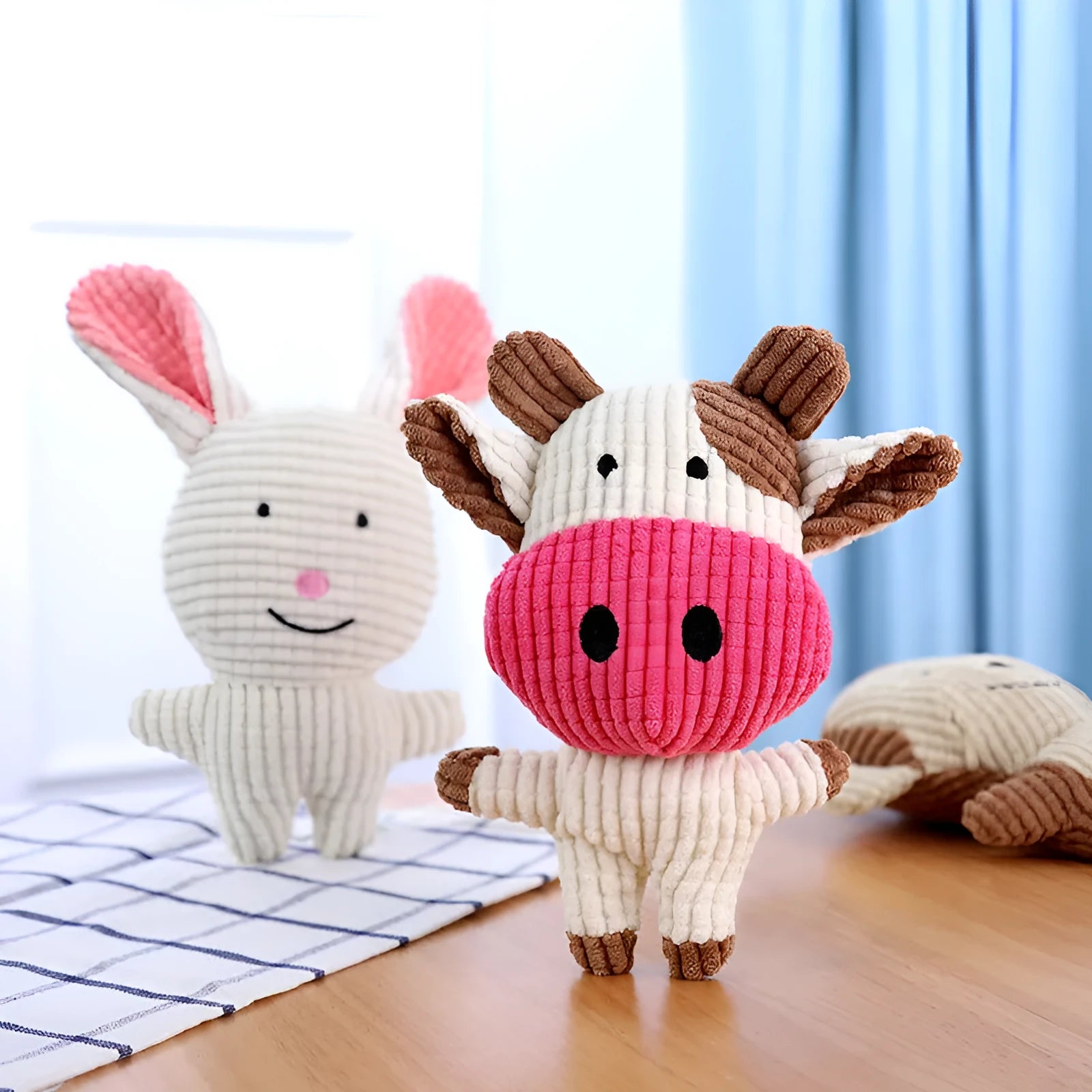 Animal-shaped plush dog chew toy with squeaker in multiple colour options