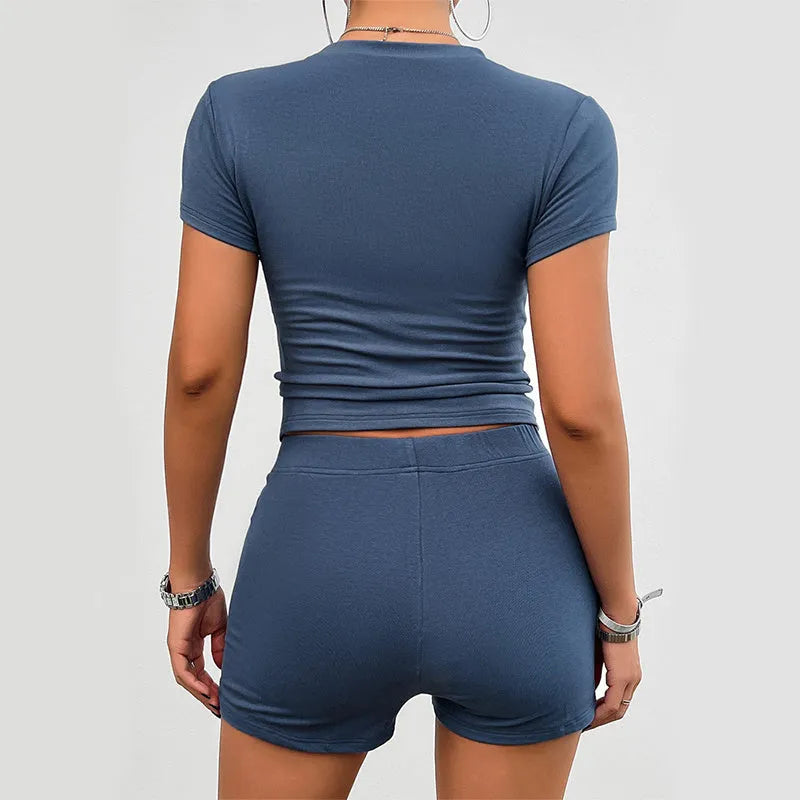 Women's solid colour slim viscose sports set with short sleeve T-shirt and elastic shorts.