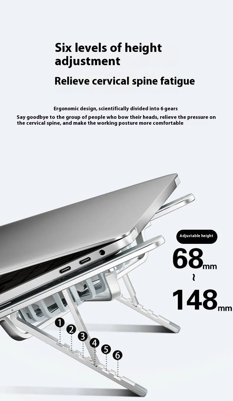 Silver aluminium laptop stand with twin cooling fans in folded position beside laptop