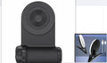 Black magnetic camera grip phone holder showing rotatable axis and ergonomic PU leather handle.