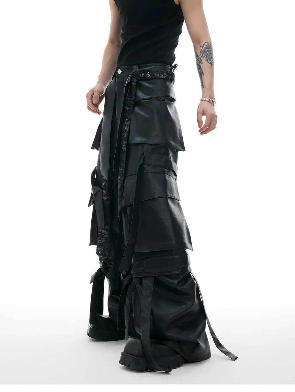 Black loose-fit quilted trousers with PU leather ribbon stitching and multiple pockets