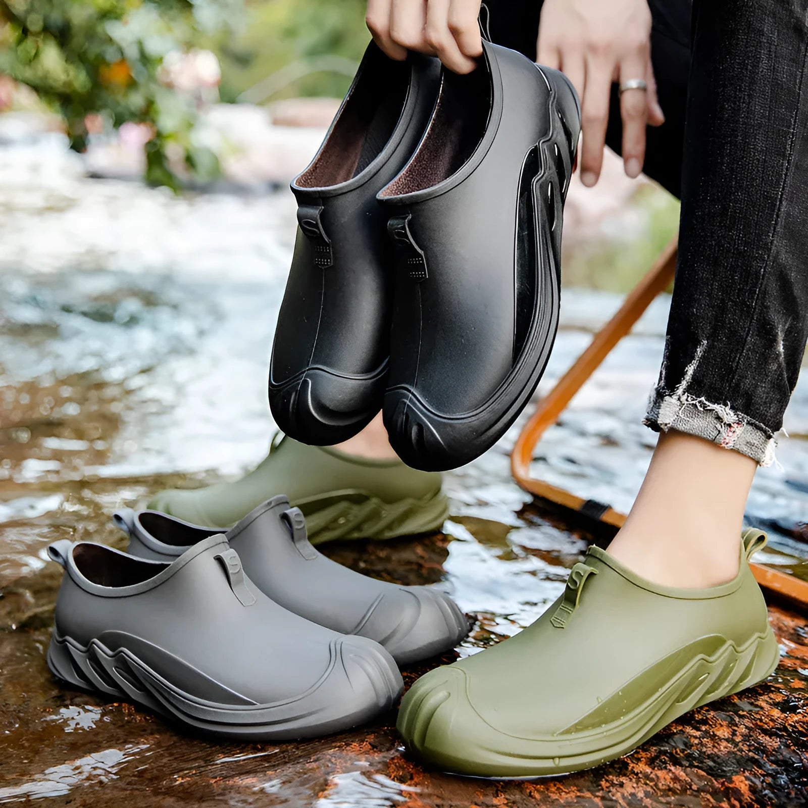 Men's short ankle-height plastic rain boot in a solid colour on a plain background.