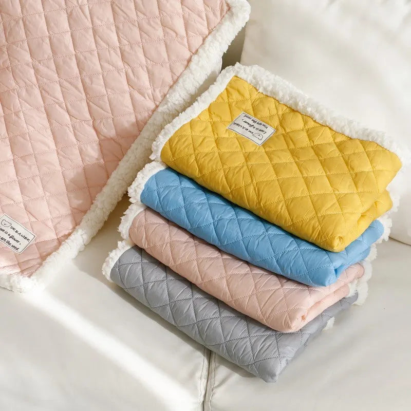 Blue warm terry cloth pet blanket for cats, shown flat with size options M, L, and XL.