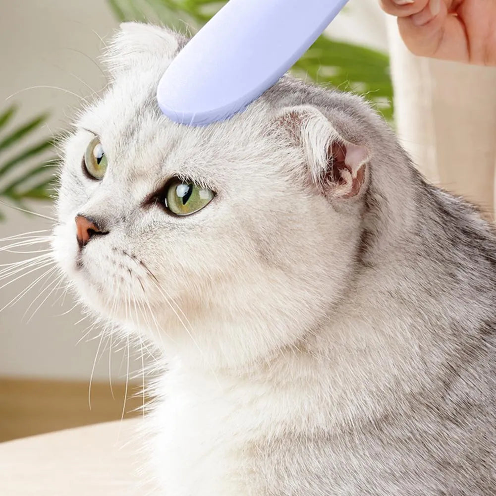 Grey and pink ABS cat grooming comb with tongue massager design and dual-width ends for pet hair removal