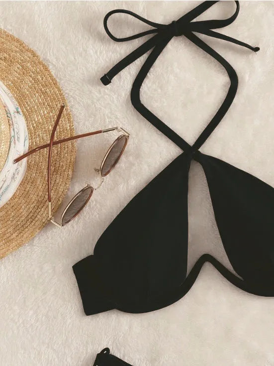 Women's brown halter-neck bikini set with backless top and briefs bottom on a mannequin