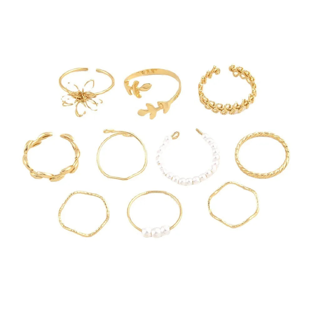 Gold openwork flower ring with delicate floral design and glossy electroplated finish
