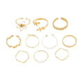 Gold openwork flower ring with delicate floral design and glossy electroplated finish