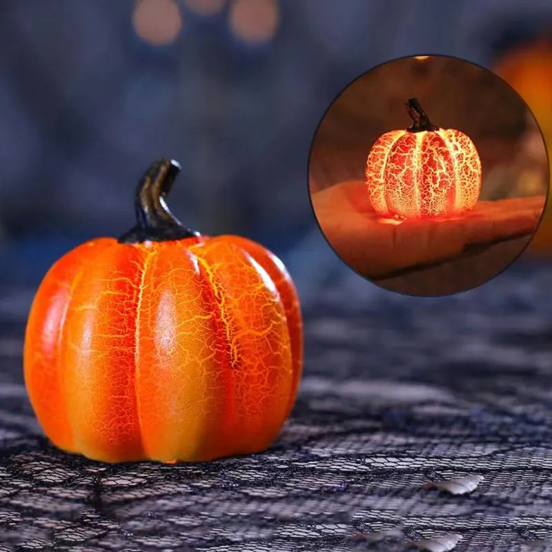 Set of three resin Halloween pumpkin lanterns with LED candle lights in short, medium, and long sizes.
