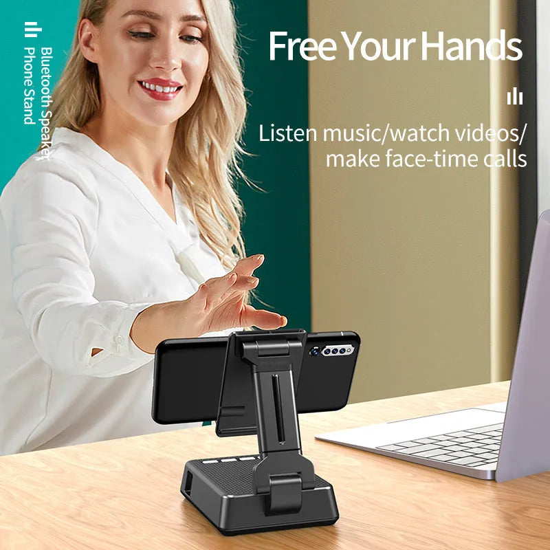 Black mobile phone stand with Bluetooth speaker on desk showing 135cm height and USB charging port