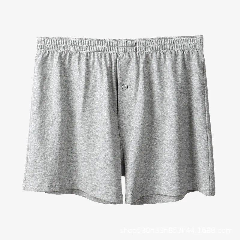 Men's high-waist cotton boxer shorts in light grey, navy blue, and black colours showing knitted fabric texture