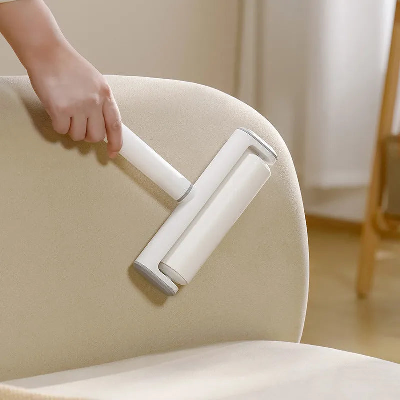 Lint removal roller tool for pet hair with tearable paper sticks on handle