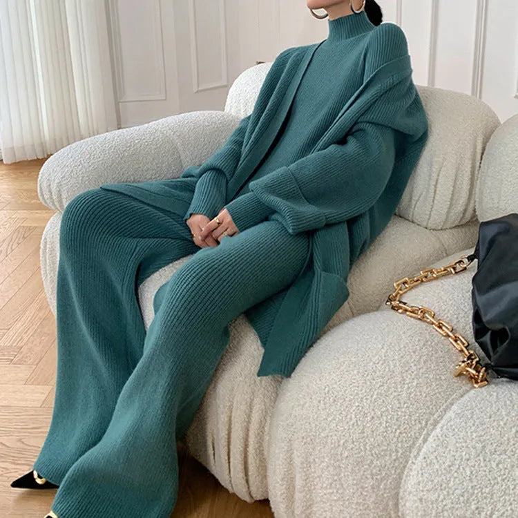 Women's knitted three-piece set with wide-leg trousers, sweater, and cardigan in solid colour with leather stitching details