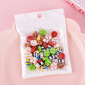 Open pearlescent film bag showing 50 small colourful cartoon fruit and theme erasers, each measuring 1-1.5 cm.