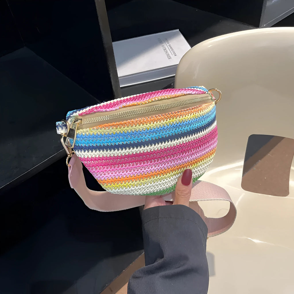 Blue straw woven women's shoulder bag with shell shape and single strap showing sandwich pocket detail