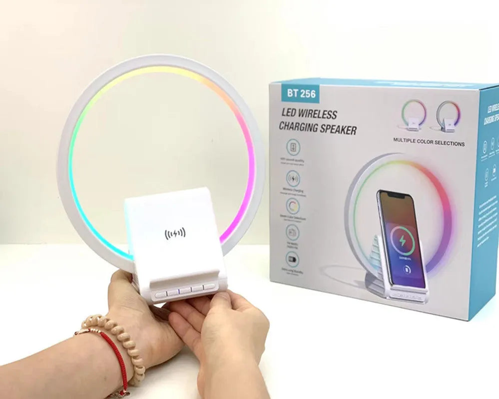 White rectangular 15W wireless charging pad with integrated Bluetooth speaker and ambience light.