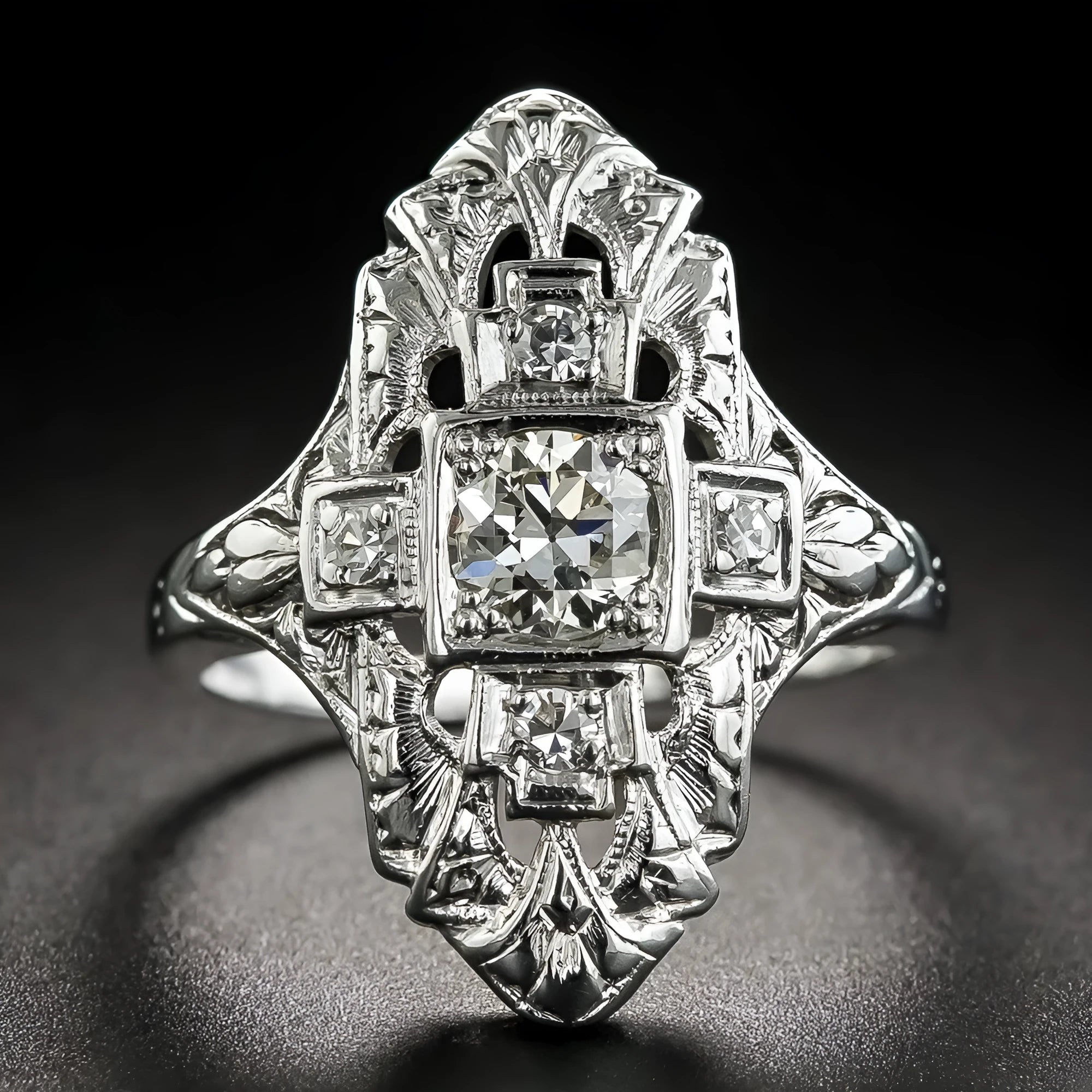 Silver electroplated hollow geometric diamond-studded ring showing negative space band design