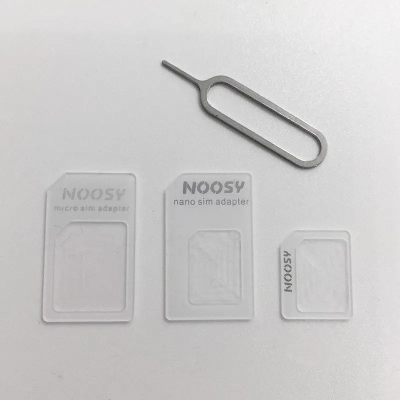 Four-in-one SIM card adapter kit with three plastic adapters and metal ejector pin on white background