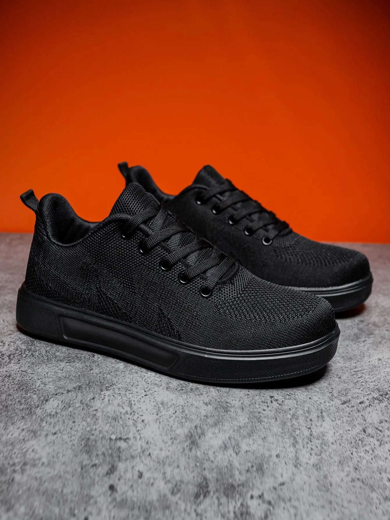 Flat heel casual board shoes with mesh upper and EVA sole in black or white colours