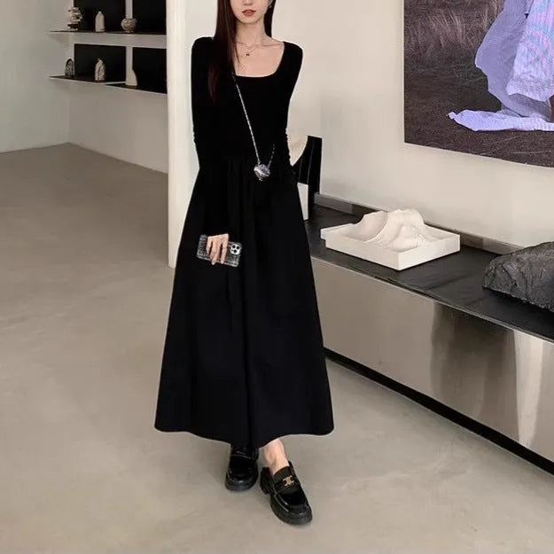Women's black square collar knitted dress with elastic waist and long A-line skirt, made from polyester fabric.