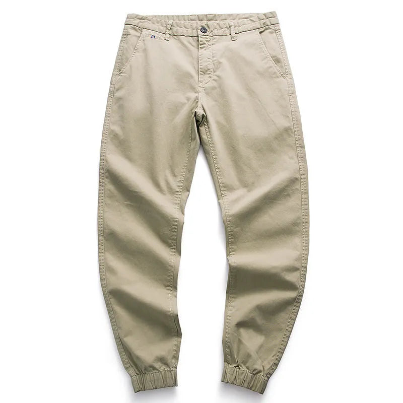 Men's cotton tapered casual trousers with ankle-tied hem, mid waist and zipper fly in khaki, black, coffee army or medium grey.
