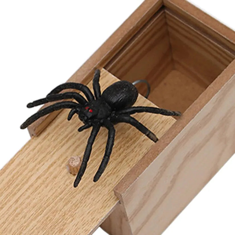 Wooden prank scare box closed, dimensions 9.1cm x 6.1cm x 6.5cm, for April Fools' jokes.
