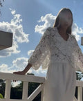 Black polyester lace cardigan with three-dimensional floral decoration and V-neck design on hanger