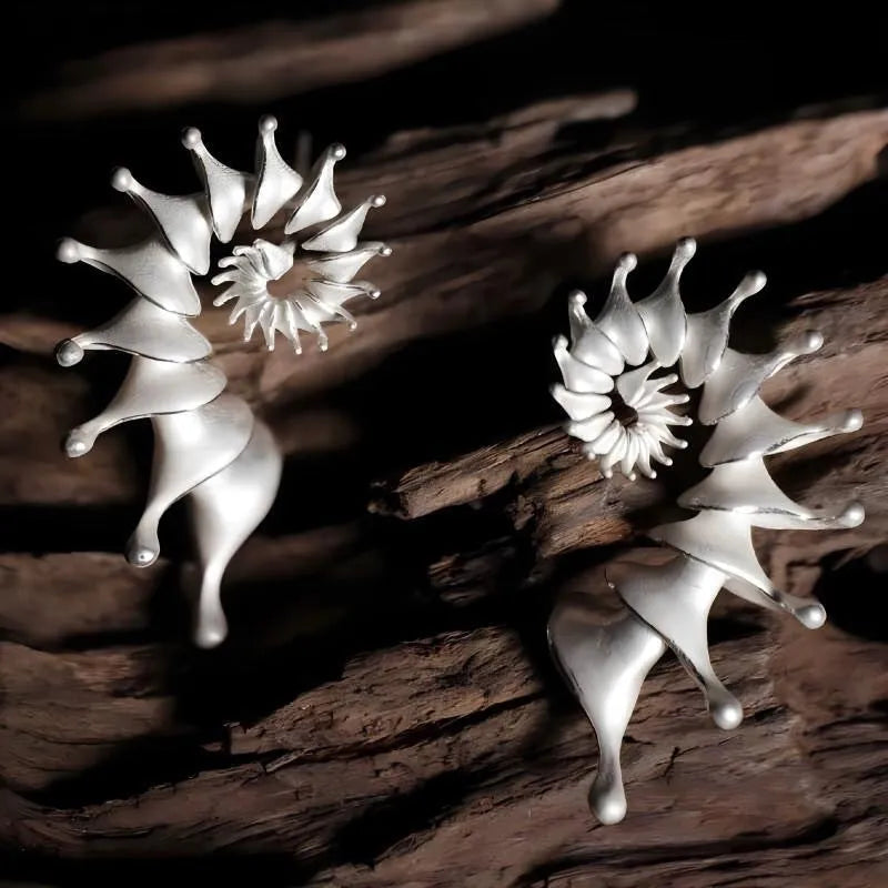 Exaggerated conch three-dimensional matte earrings with irregular shape elements and alloy construction