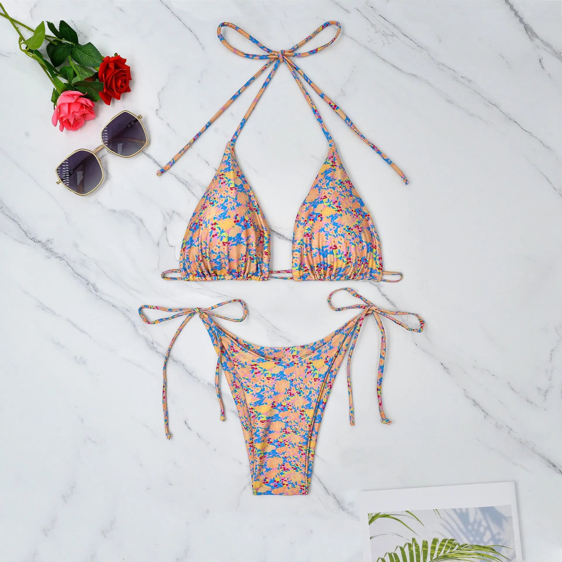 A picture colour lace-up bikini swimsuit with a backless, European and American split design.