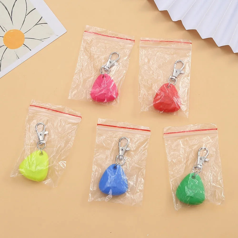 Silicone triangle-shaped light-up pendant pet ornament in one of five colours: red, pink, blue, green, or yellow.