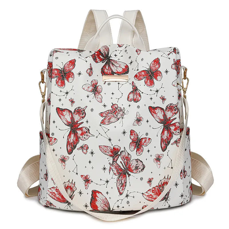 Butterfly printed black PU leather backpack with visible sewing lines and a physiological curve backplate.