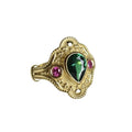 Gold-plated geometric fashion ring for women on grey background showing detailed design