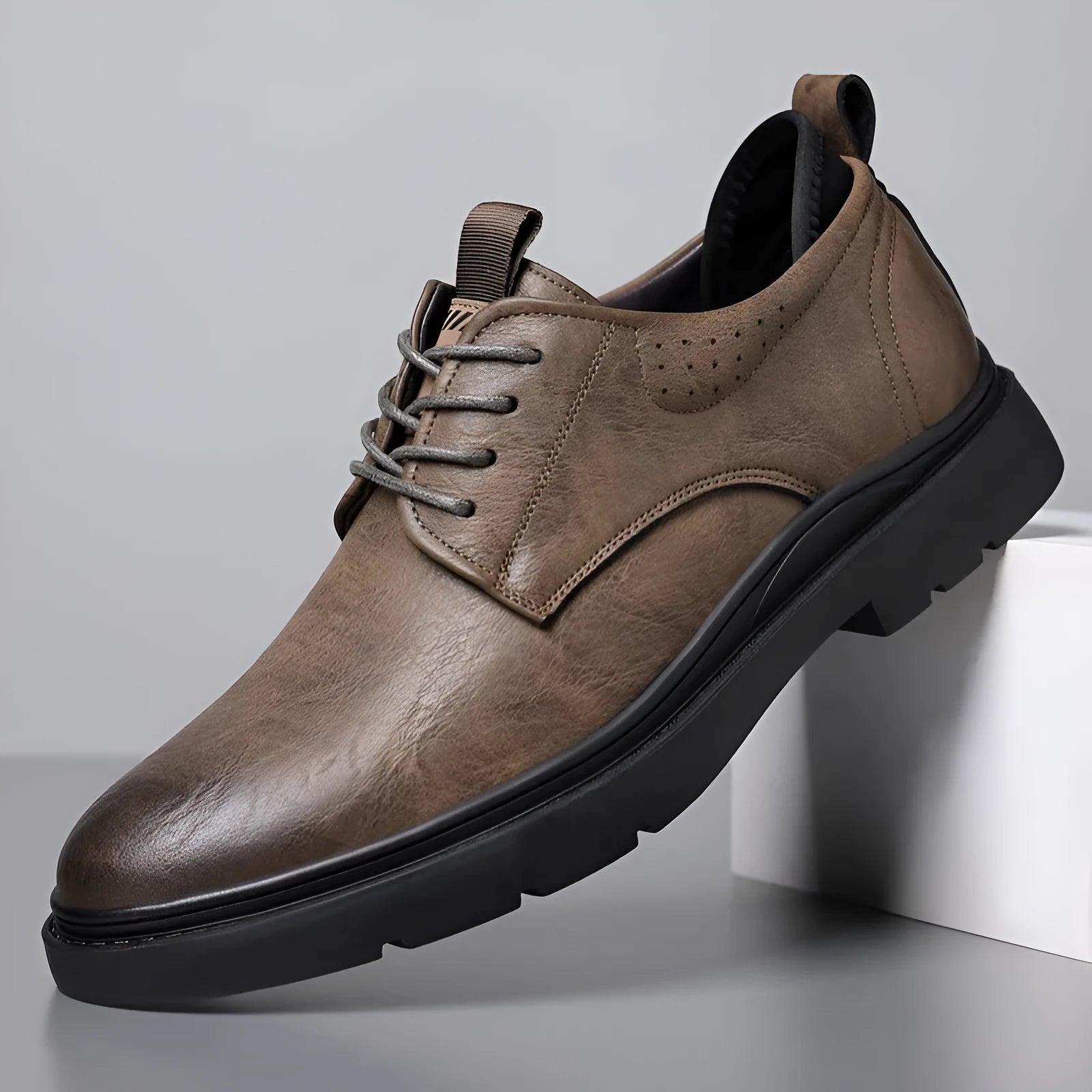 Men's black and brown leather business shoes with rubber soles and sewing line detail