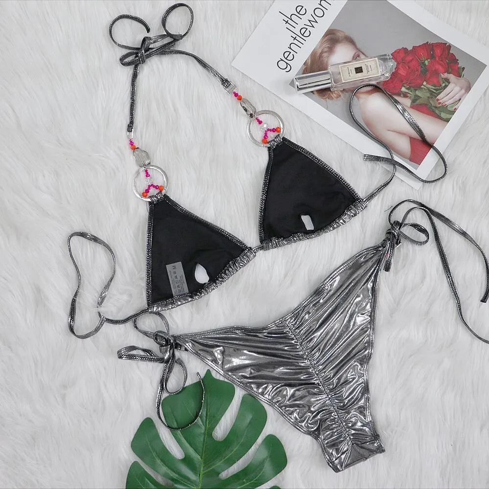 Silver women's bikini swimsuit with split-style briefs on mannequin