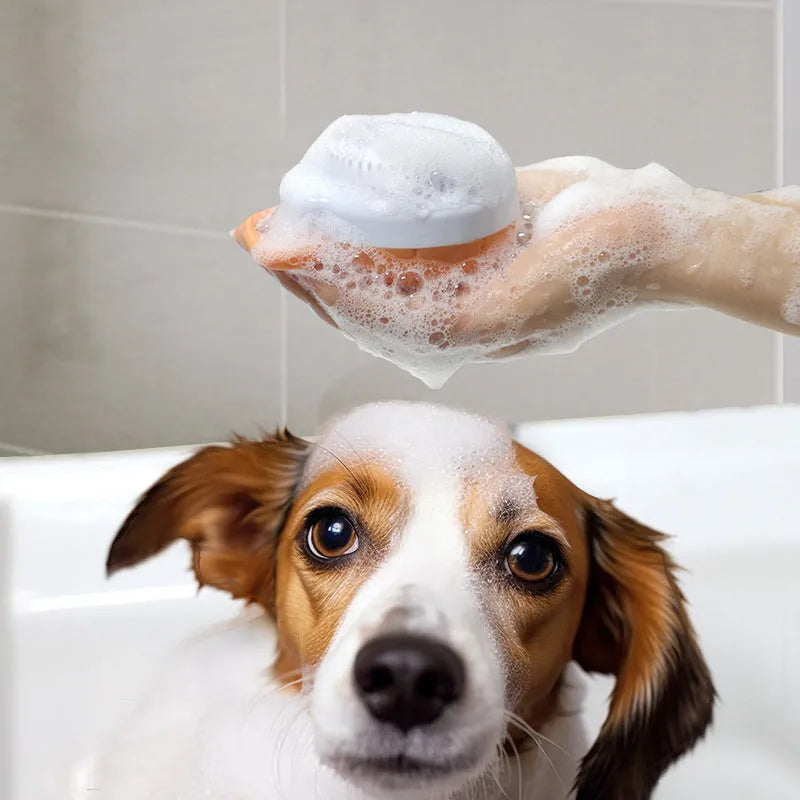 Orange TPR dog bath brush with shampoo dispenser and comb teeth for pet grooming
