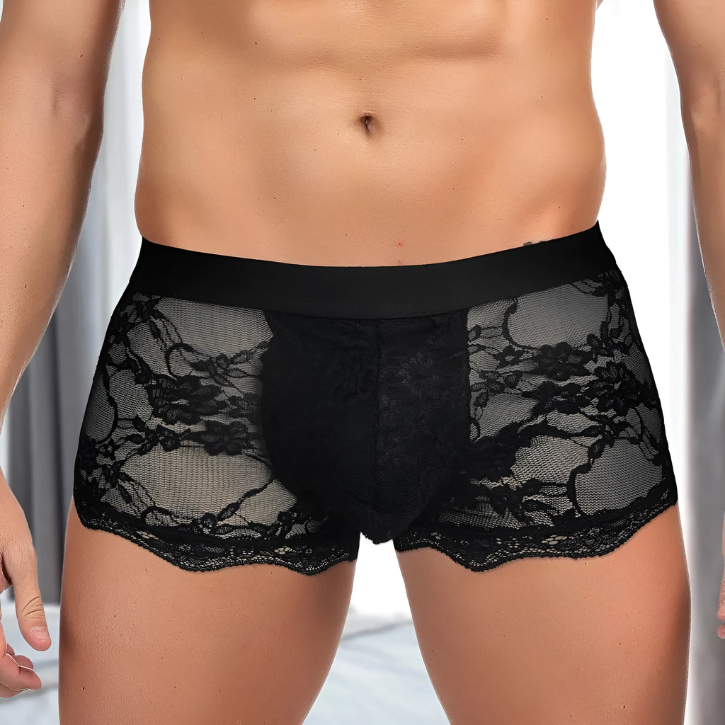Men's black lace briefs with hollow-out see through design showing transparent construction