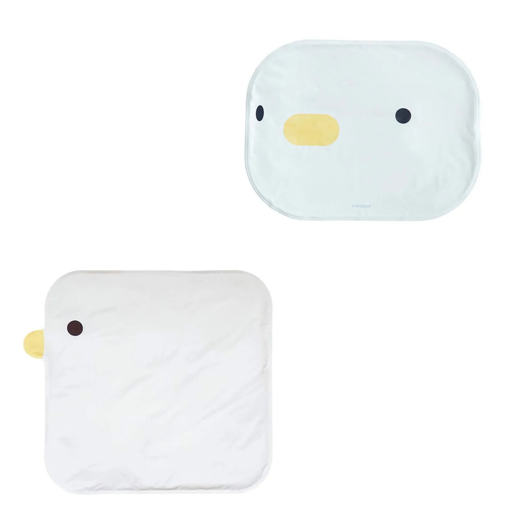 Blue chick-shaped washable pet cooling mat on a wooden floor.