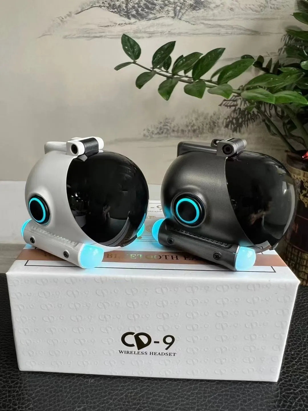 Black and white clip-type wireless Bluetooth sports headset showing compact design
