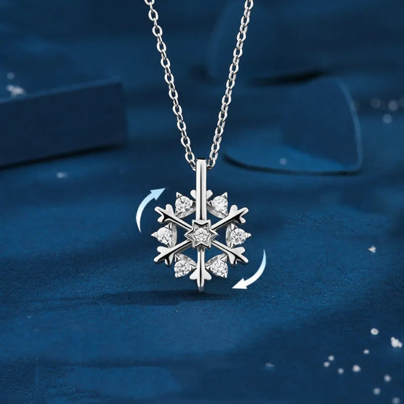 Rotatable S925 silver snowflake necklace for women with rhinestone detail, available in rose gold or white gold.