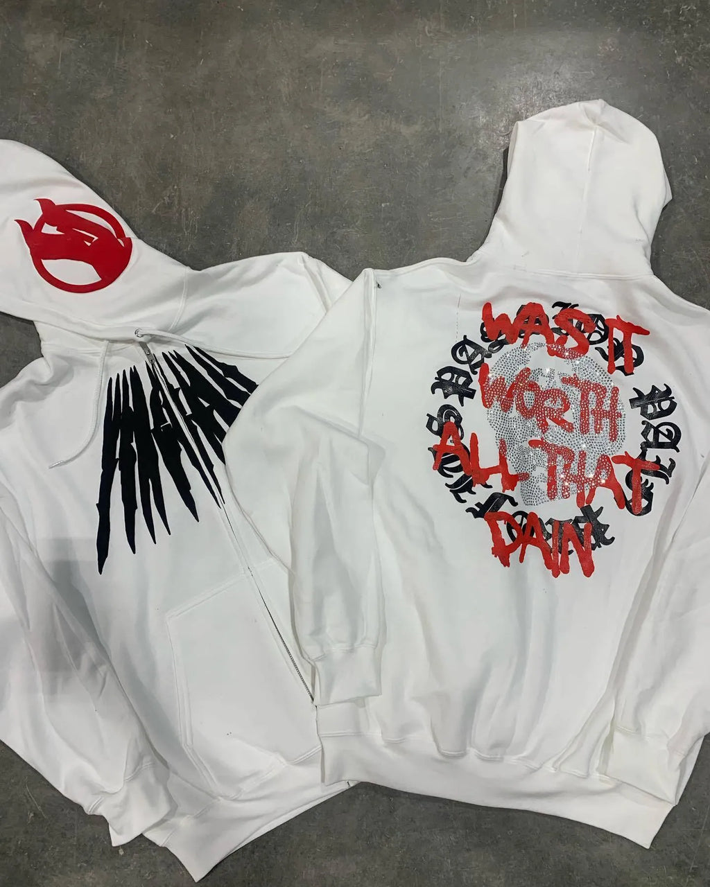 Black loose hooded sweatshirt with printed skull pattern and rhinestone details, cardigan style